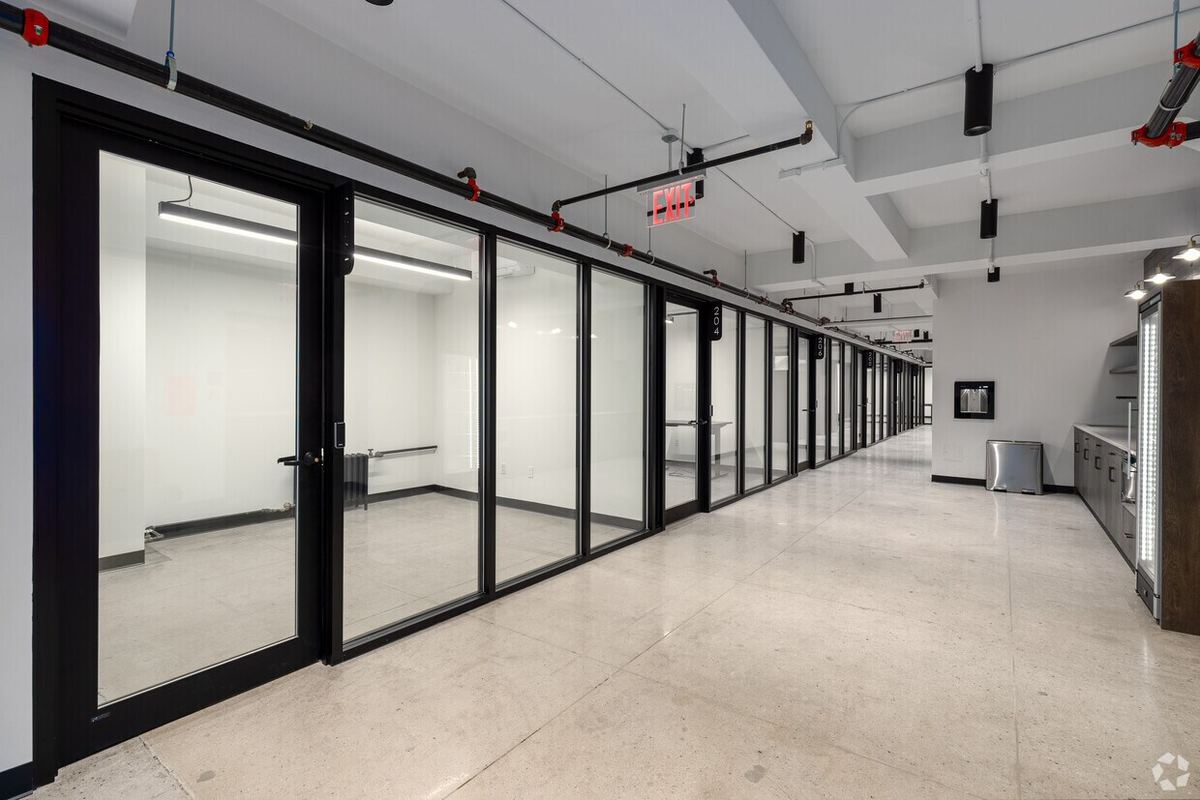 A row of private, glass-door offices